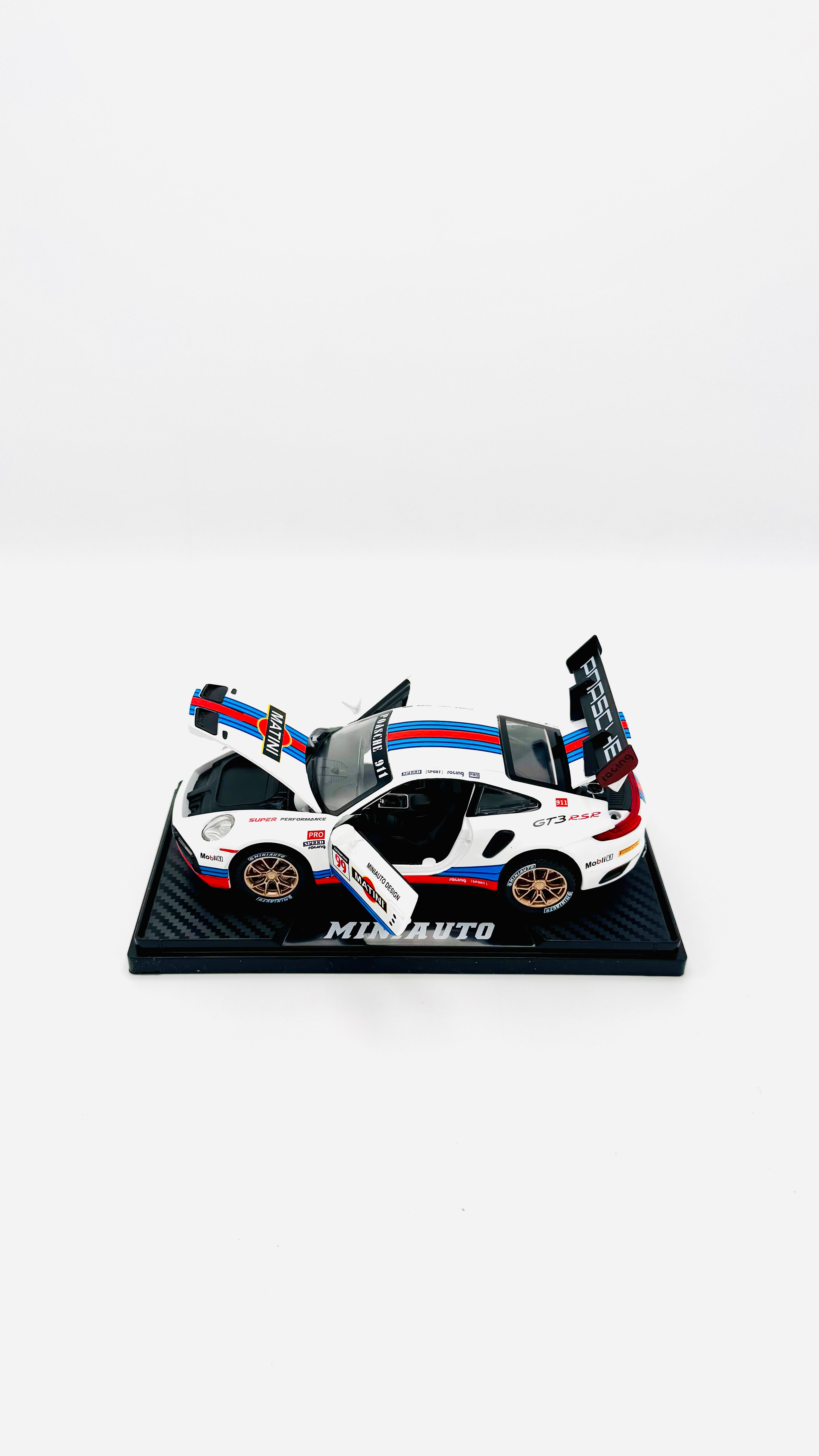 White racing car on stand with all doors open