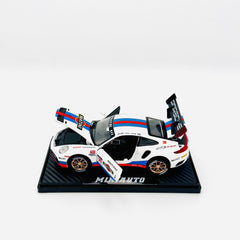 White racing car on stand with all doors open