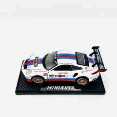 White racing car on display stand, side view