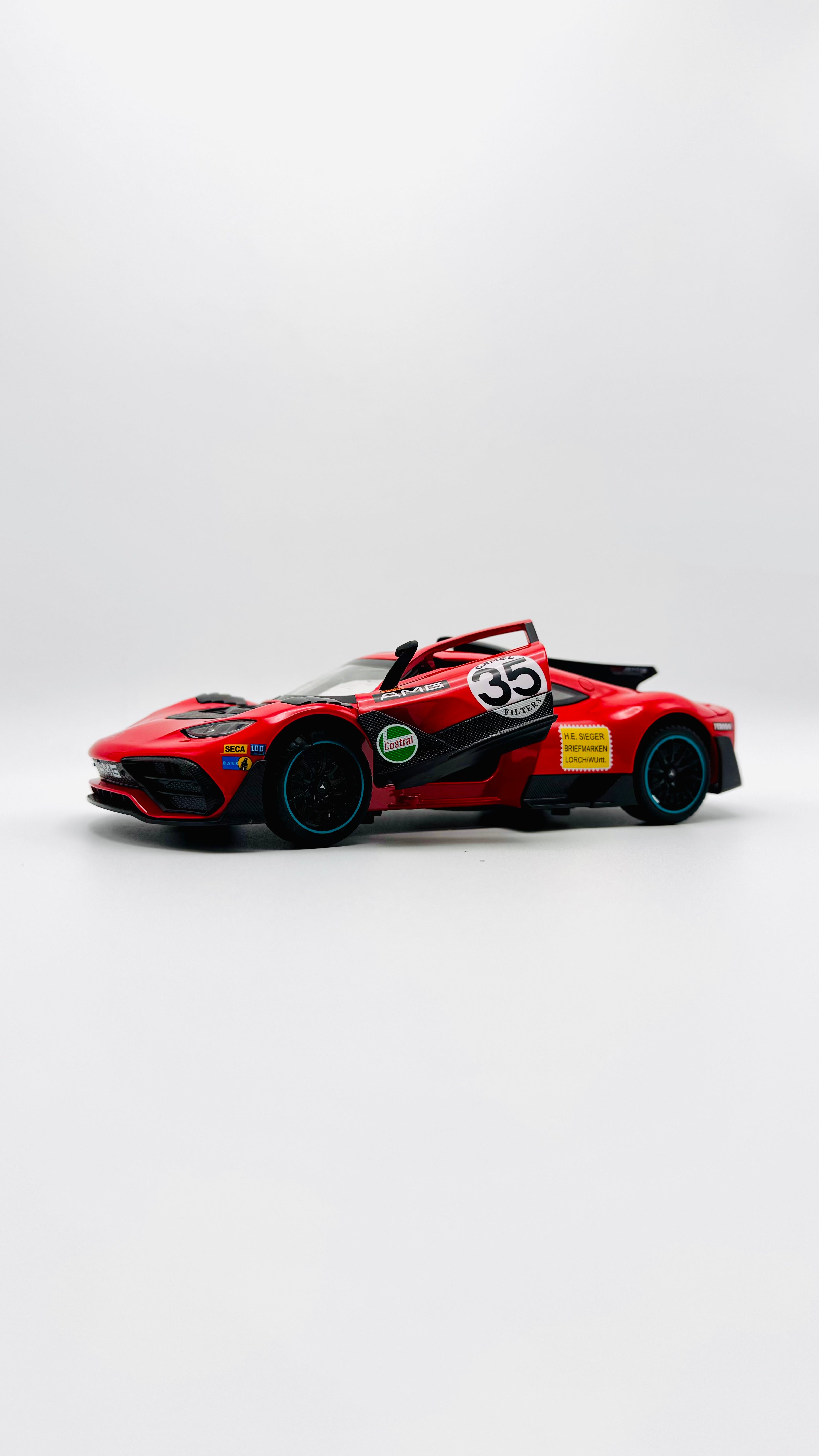 1:32 die-cast red sports car with opening doors