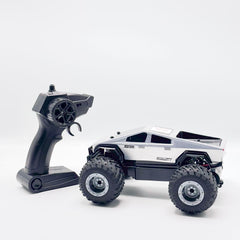 RC off-road truck side view with pistol-grip handset