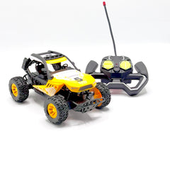 Yellow RC buggy with roll cage and controller