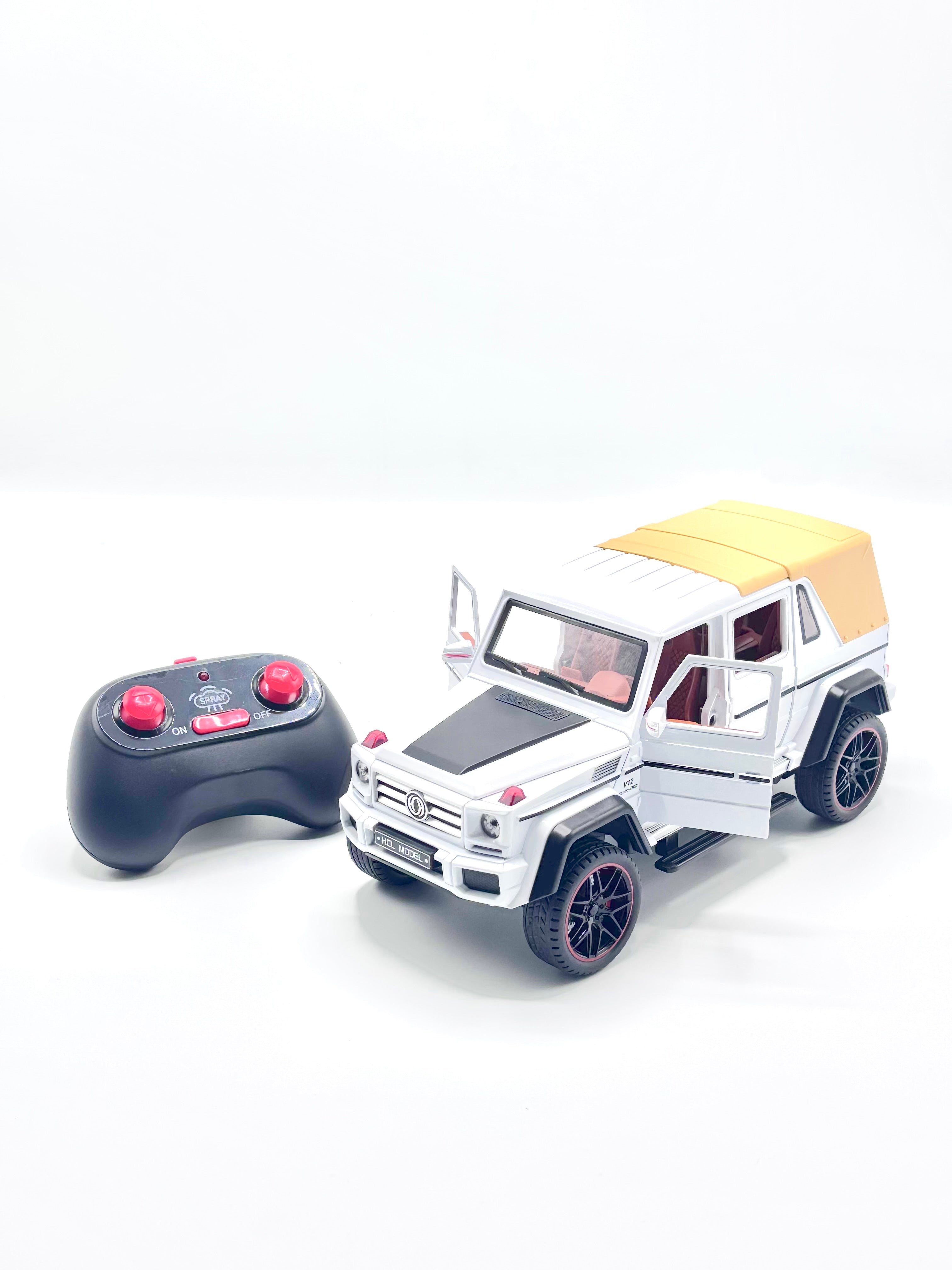 White RC die-cast 4x4 SUV with doors open and controller