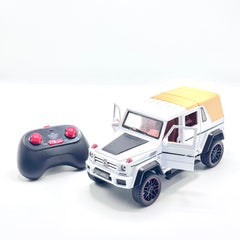 White RC die-cast 4x4 SUV with doors open and controller