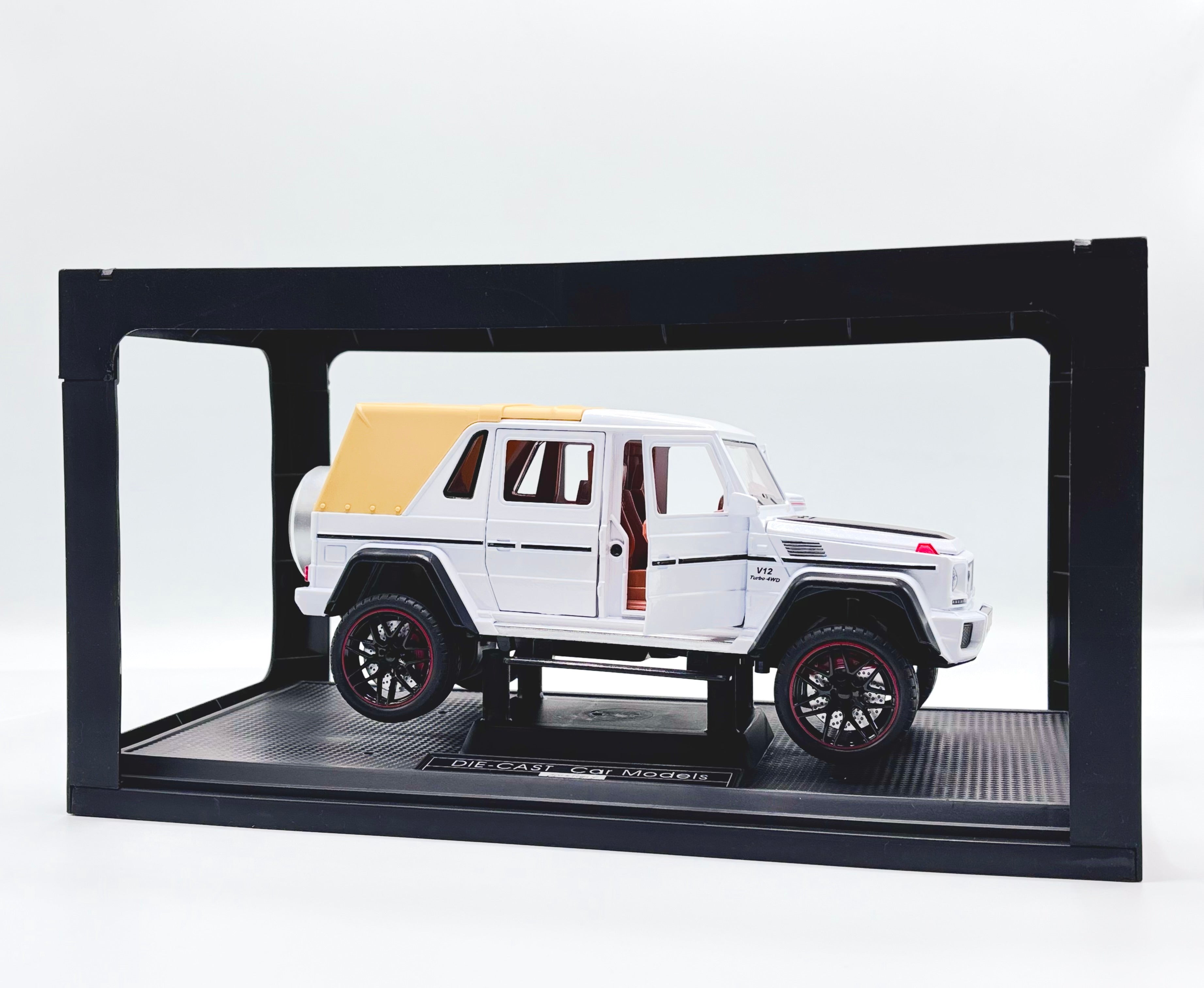 Die-cast SUV in display case with doors open