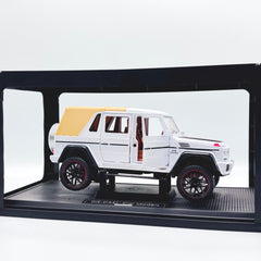 Die-cast SUV in display case with doors open